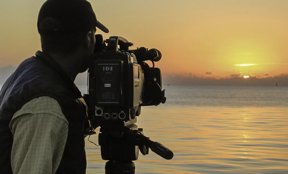 Todd Moen filming at sunset